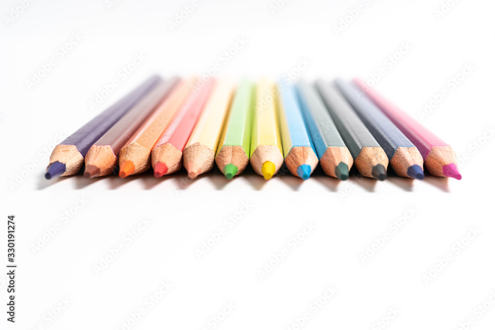many colored pencils on white background many colored pencils on white background