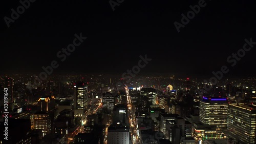 Wallpaper Mural SAPPORO, HOKKAIDO, JAPAN - FEB 2020 : Aerial high angle sunrise view of cityscape of Sapporo city. View of buildings and street traffic around Susukino downtown area. Time lapse shot night to morning. Torontodigital.ca