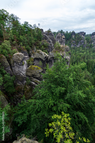 Rock formations in Saxon Switzerland near Dresden with fog © Asvolas