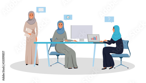 Fotografiet Successful and creative Arab businesswomen team working together on a project in modern office, sitting at the desk, wearing hijab