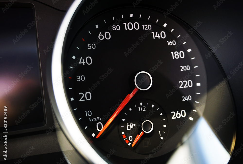 Speedometer of a modern car with an integrated fuel gauge in the tank