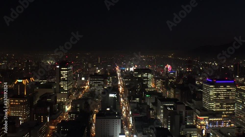 Wallpaper Mural SAPPORO, HOKKAIDO, JAPAN - FEB 2020 : Aerial high angle sunrise view of cityscape of Sapporo city. View of buildings and street traffic around Susukino downtown area. Time lapse shot night to morning. Torontodigital.ca