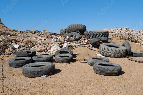 Tyres lies on the dump, abuse of environment photo