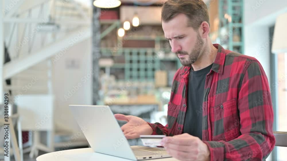 Unsuccessful Online Payment on Laptop by Young Man Unsuccessful Online Payment on Laptop by Young Man
