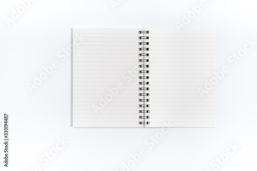 Brown spiral notebook isolated on white background.top view