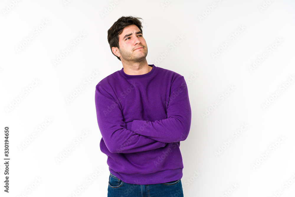 Fototapeta premium Young man isolated on white background dreaming of achieving goals and purposes