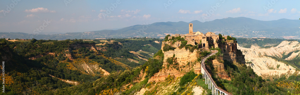 Picturesque panoramic sunset view of ancient italian hilltop town of Civita di Bagnoregio, known as the 
