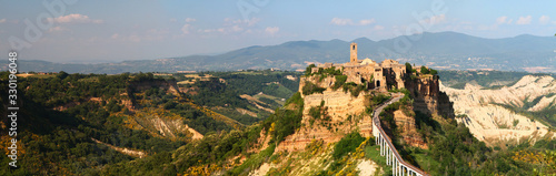 Picturesque panoramic sunset view of ancient italian hilltop town of Civita di Bagnoregio, known as the "castle in the sky". Lazio. Italy.