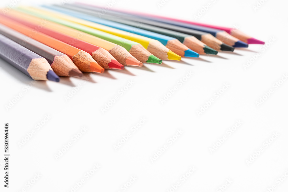 many colored pencils on white background many colored pencils on white background