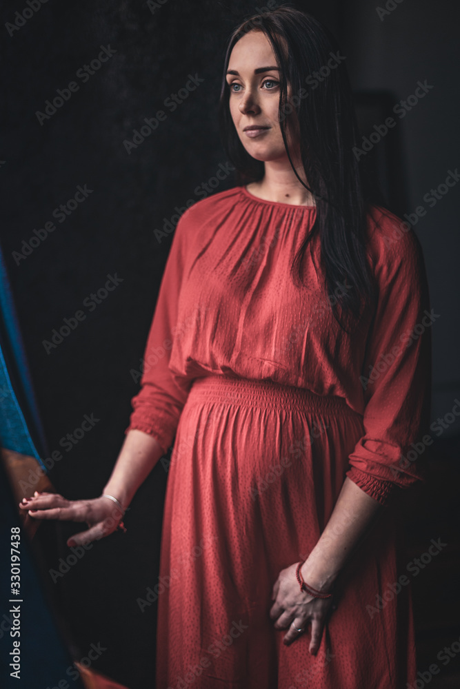 A pregnant girl together with her beloved poses and rejoices in pregnancy. Happy moments A pregnant girl together with her beloved poses and rejoices in pregnancy. Happy moments
