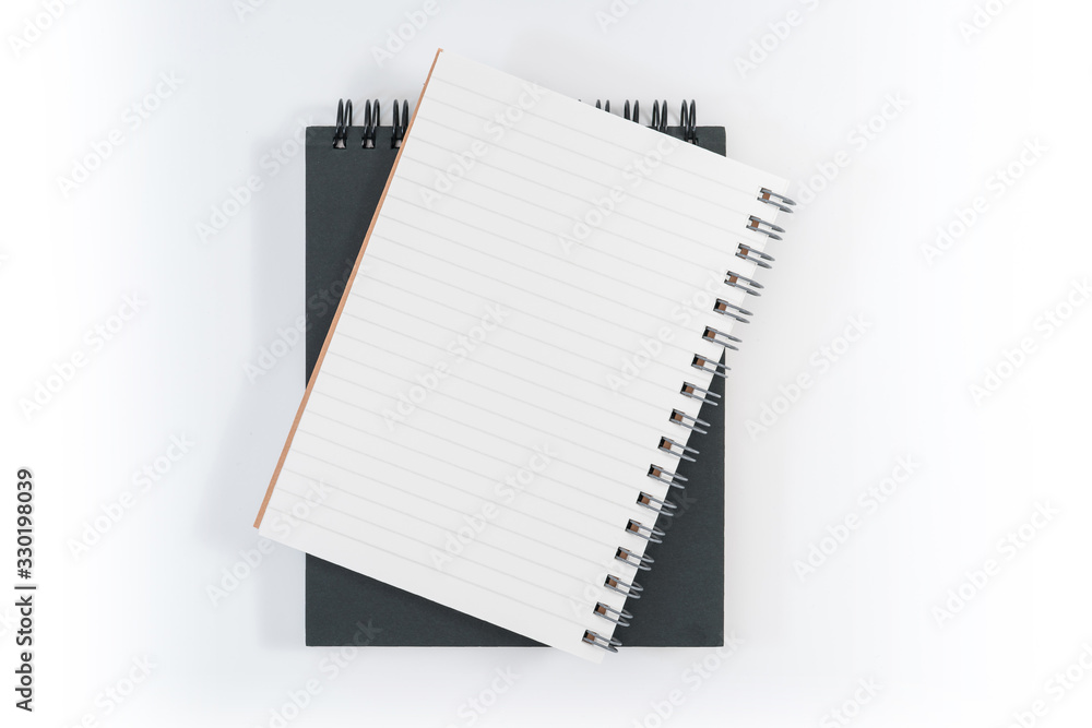 school notebook on a blue background, spiral notepad on a table school notebook on a blue background, spiral notepad on a table