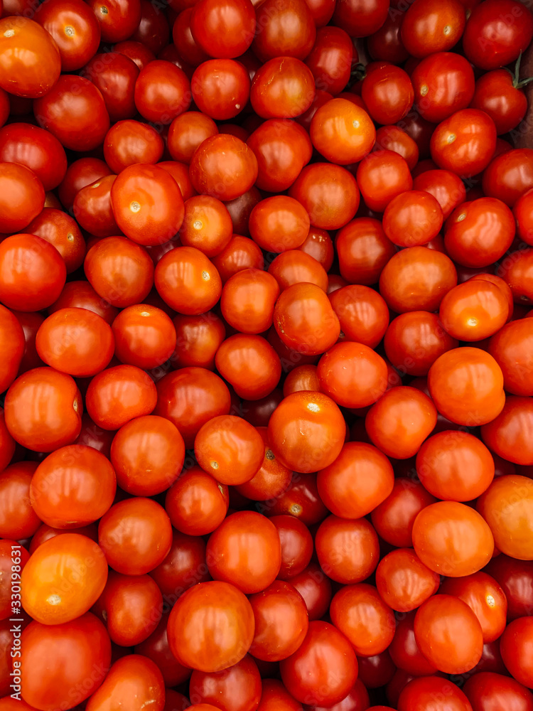 lots of ripe delicious red tomatoes for eating like a background
