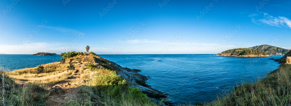 Panorama landscape of Promthep cape in morning with sunlight and beautiful blue sky (Phuket, Thailand)