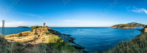 Panorama landscape of Promthep cape in morning with sunlight and beautiful blue sky (Phuket, Thailand)