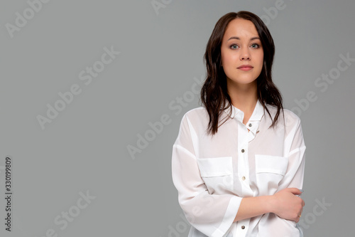 Cheerful young new attractive female employee ready help energized look upbeat confident camera cross arms chest self-assured smiling toothy aim bright successful future, standing gray background