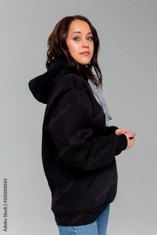 Woman in black hoodie, mockup for logo or branding design