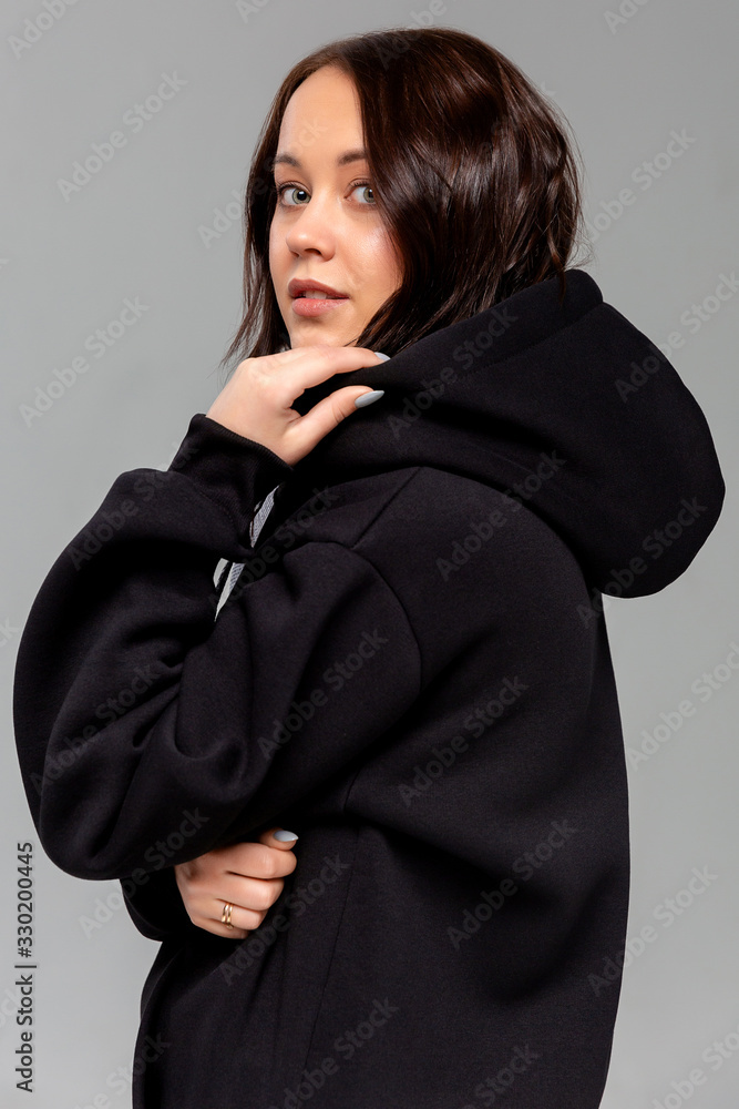 Woman in black hoodie, mockup for logo or branding design