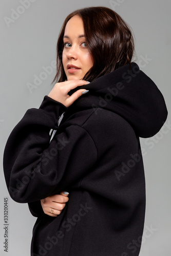 Obraz na płótnie Woman in black hoodie, mockup for logo or branding design w salonie