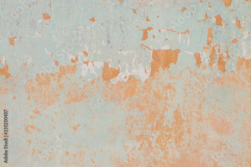 old shabby wall in yellow-blue shades