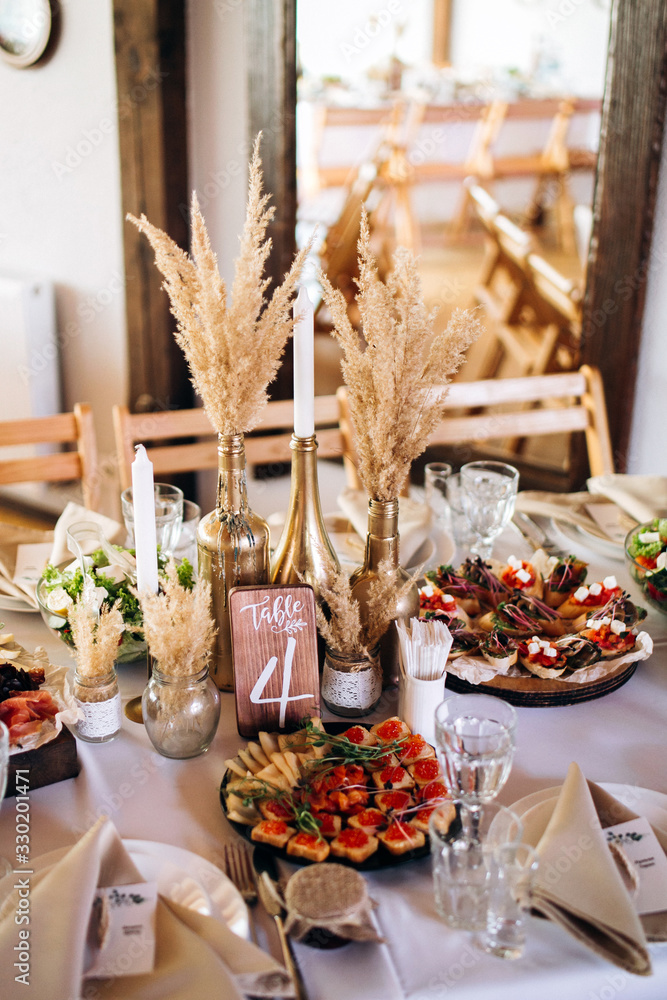 Beautiful wedding table decoration and decor in boho or rustic style