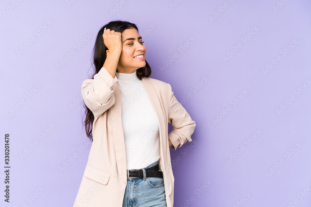 Young indian woman isolated on purple background celebrating a victory, passion and enthusiasm, happy expression. Young indian woman isolated on purple background celebrating a victory, passion and enthusiasm, happy expression.