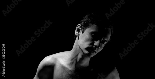 expressive photo, black and white portrait of a guy, with hard light
