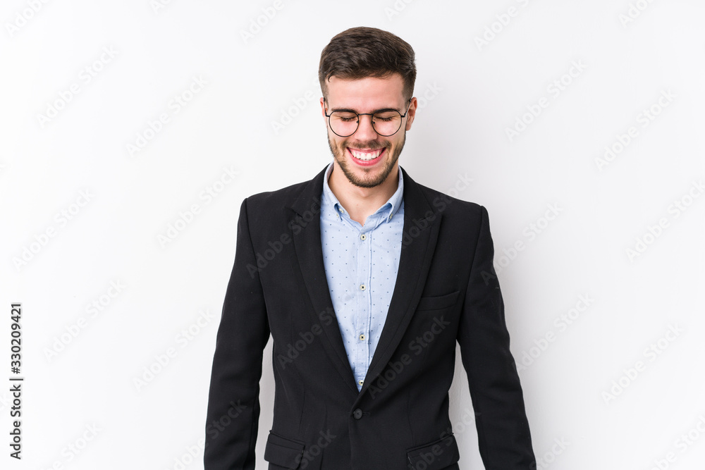 Young caucasian business man posing in a white background isolated Young caucasian business man laughs and closes eyes, feels relaxed and happy. Young caucasian business man posing in a white background isolated Young caucasian business man laughs and closes eyes, feels relaxed and happy.