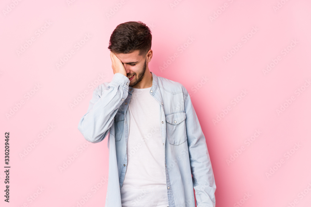 Young caucasian business man posing in a white background isolated forgetting something, slapping forehead with palm and closing eyes.< mixto > Young caucasian business man posing in a white background isolated forgetting something, slapping forehead with palm and closing eyes.< mixto >