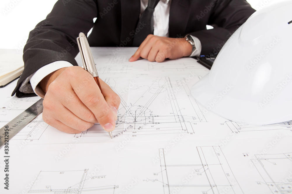 Cropped image of a professional engineer correcting a blueprint Cropped image of a professional engineer correcting a blueprint