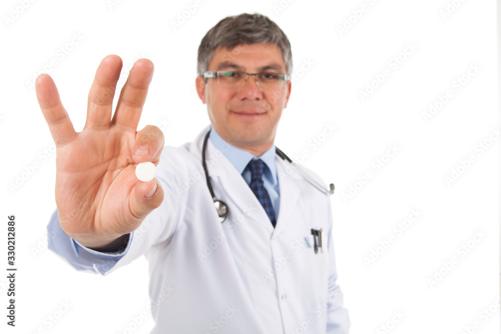 Gray haired doctor hoding pill on white Gray haired doctor hoding pill on white