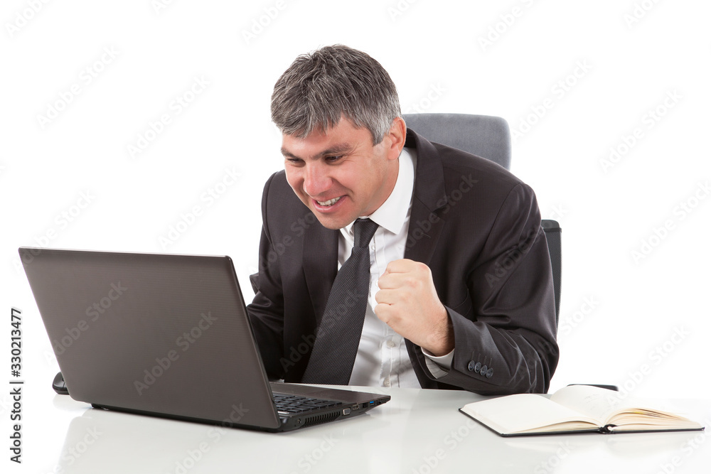 Gray haired businessman working on laptop and he is exiting Gray haired businessman working on laptop and he is exiting