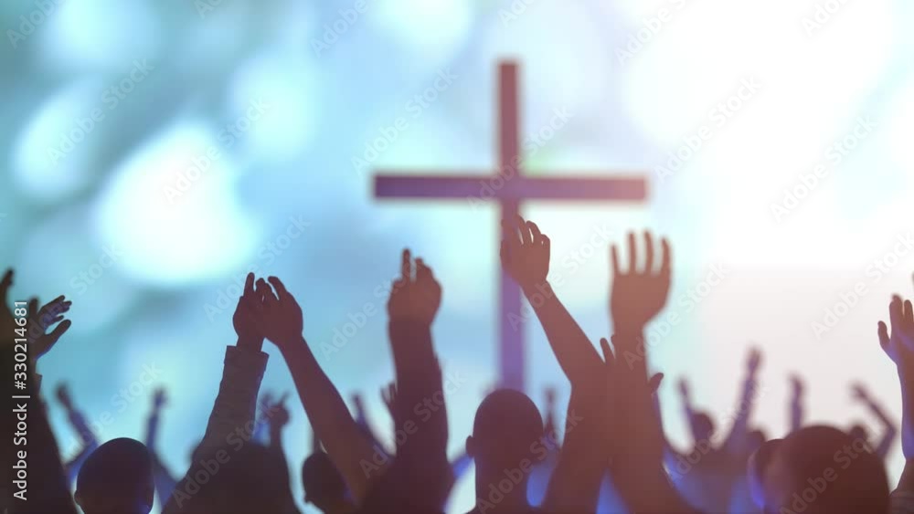 hands of a crowd of people at a Christian meeting during the glorification praise of God against the background of the cross 3d render