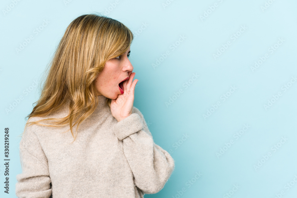 Young blonde caucasian woman being shocked because of something she has seen. Young blonde caucasian woman being shocked because of something she has seen.