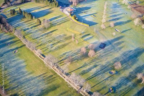 Wallpaper Mural Aerial view of links golf course during summer showing green and bunkers at driving range club house Torontodigital.ca
