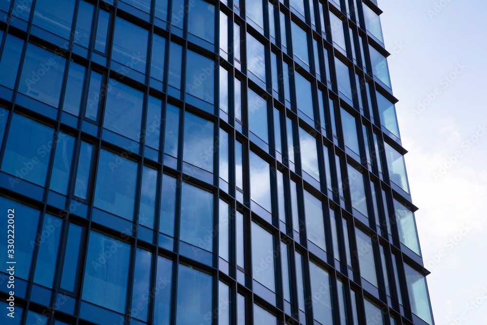Modern office building facade abstract fragment, shiny windows in steel structure Modern office building facade abstract fragment, shiny windows in steel structure