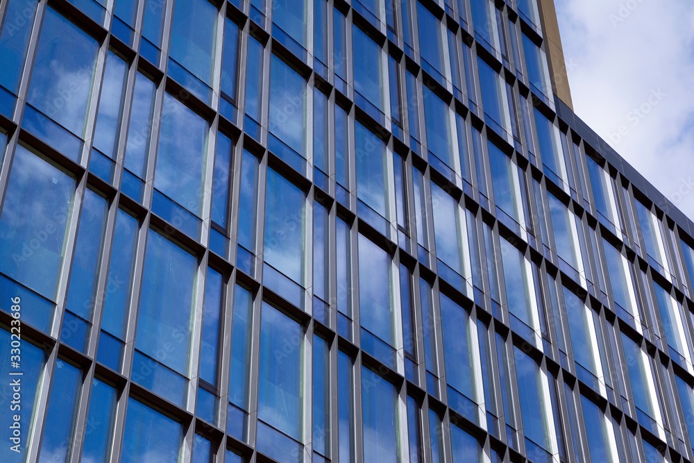 Modern office building facade abstract fragment, shiny windows in steel structure Modern office building facade abstract fragment, shiny windows in steel structure