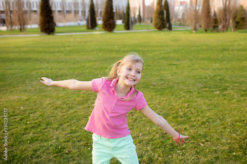 Happy children run in the park, play and have fun.