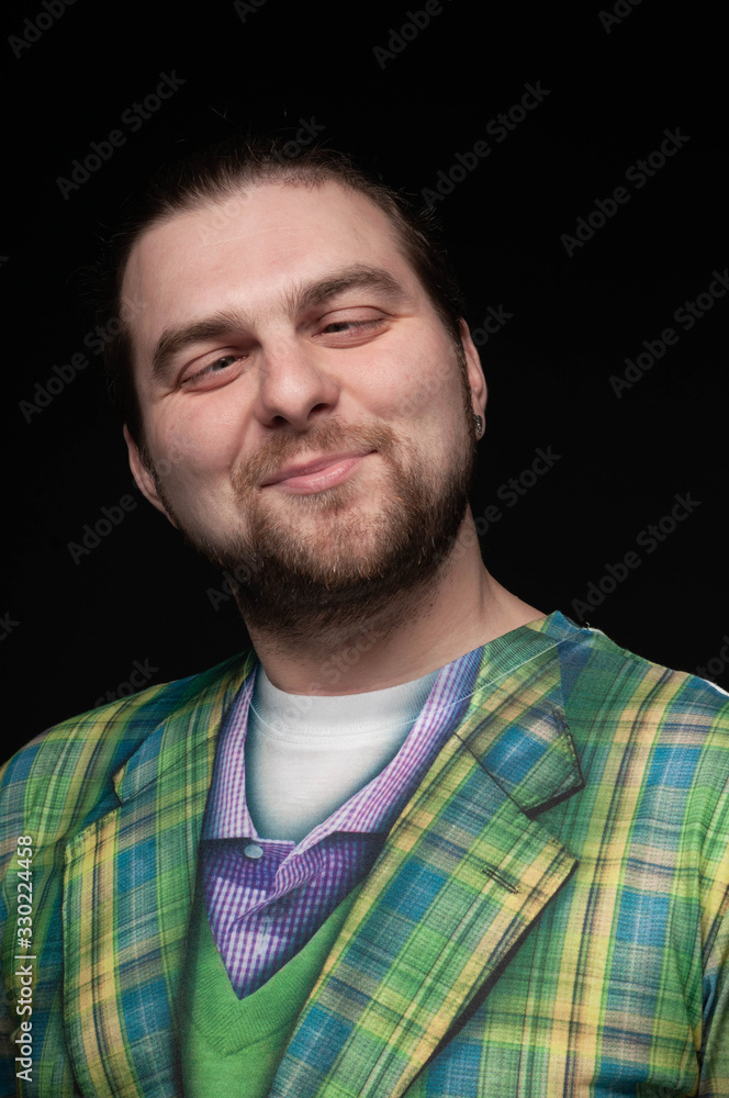 handsome stylish fooling around bearded man in green checkered blazer rolling eyes isolated on black handsome stylish fooling around bearded man in green checkered blazer rolling eyes isolated on black