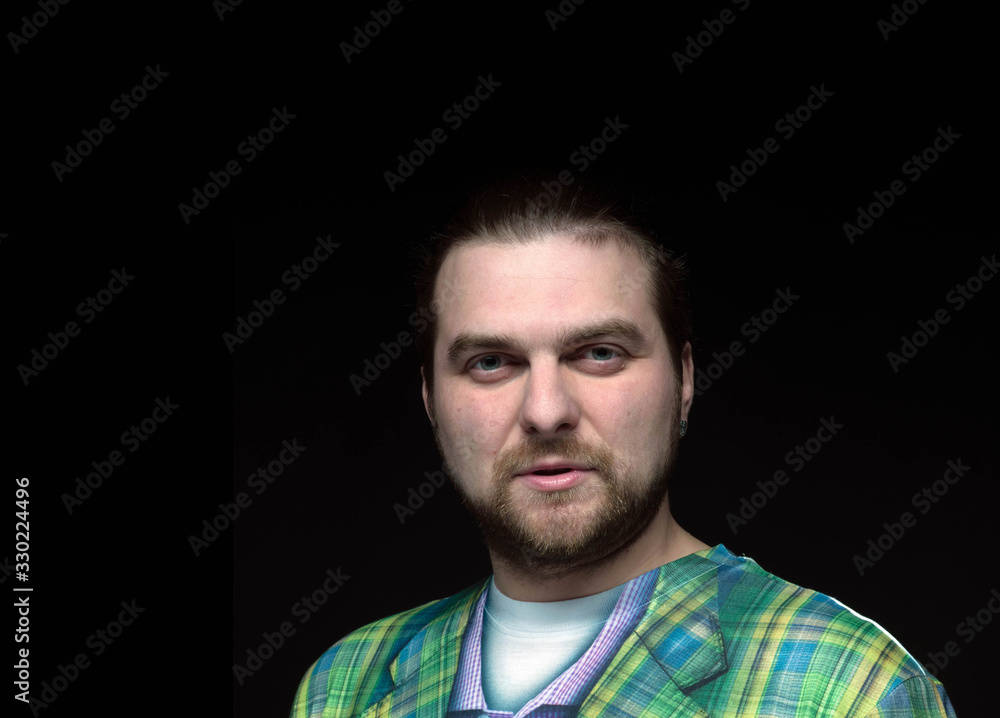 handsome stylish bearded man in green blazer looking at camera isolated on black handsome stylish bearded man in green blazer looking at camera isolated on black
