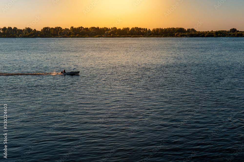 View of the river at sunset. Warm summer evening View of the river at sunset. Warm summer evening