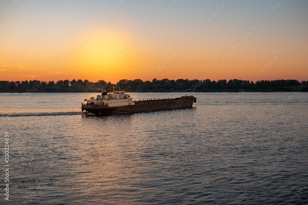 View of the river at sunset. Warm summer evening View of the river at sunset. Warm summer evening