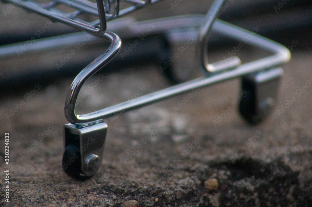 The wheels of a toy trolley clearly visible The wheels of a toy trolley clearly visible