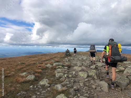 Group of hikers in New Hampshire descending Mt. Moosilauke .