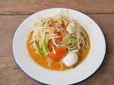 One dish of Thai papaya salad is placed on the table.