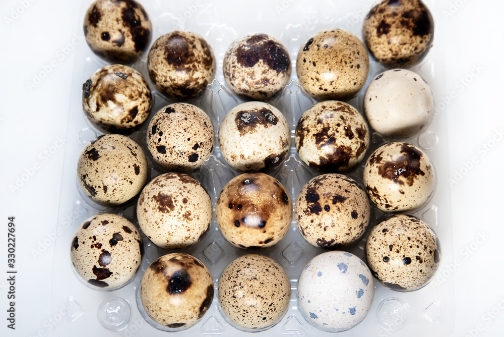 textured small quail eggs in a tray, top view. healthy ecological diet food textured small quail eggs in a tray, top view. healthy ecological diet food