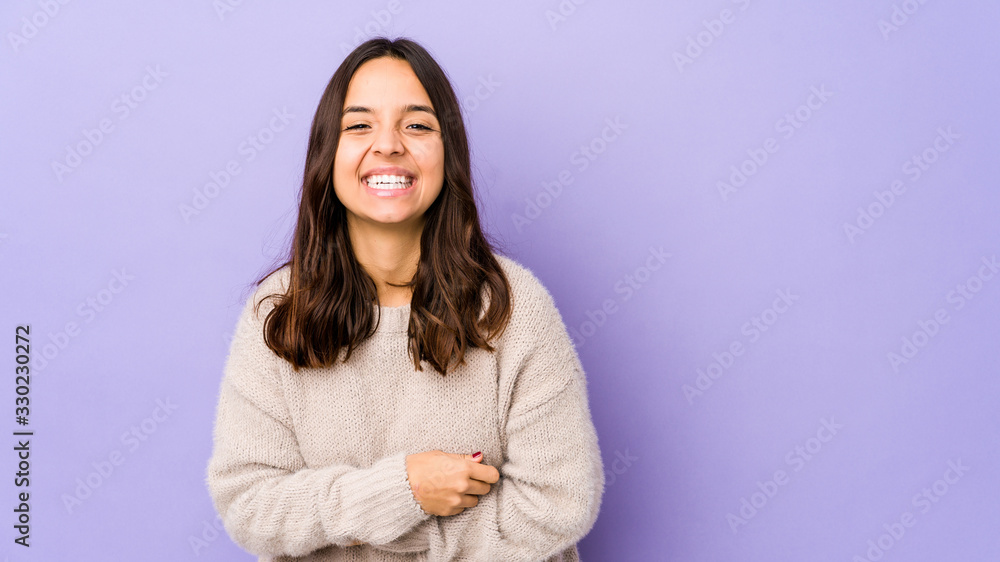 Young mixed race hispanic woman isolated laughing and having fun. Young mixed race hispanic woman isolated laughing and having fun.