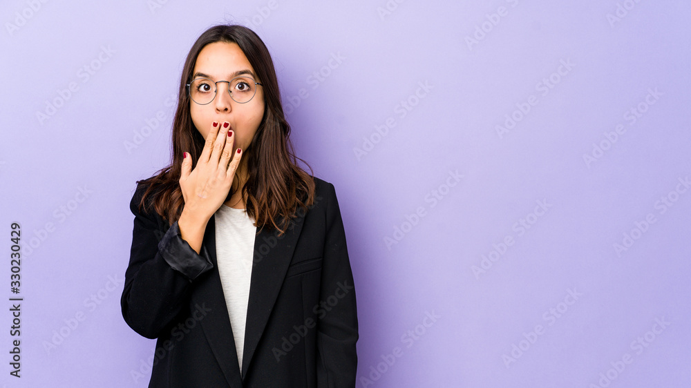 Young mixed race hispanic woman isolated shocked, covering mouth with hands, anxious to discover something new. Young mixed race hispanic woman isolated shocked, covering mouth with hands, anxious to discover something new.