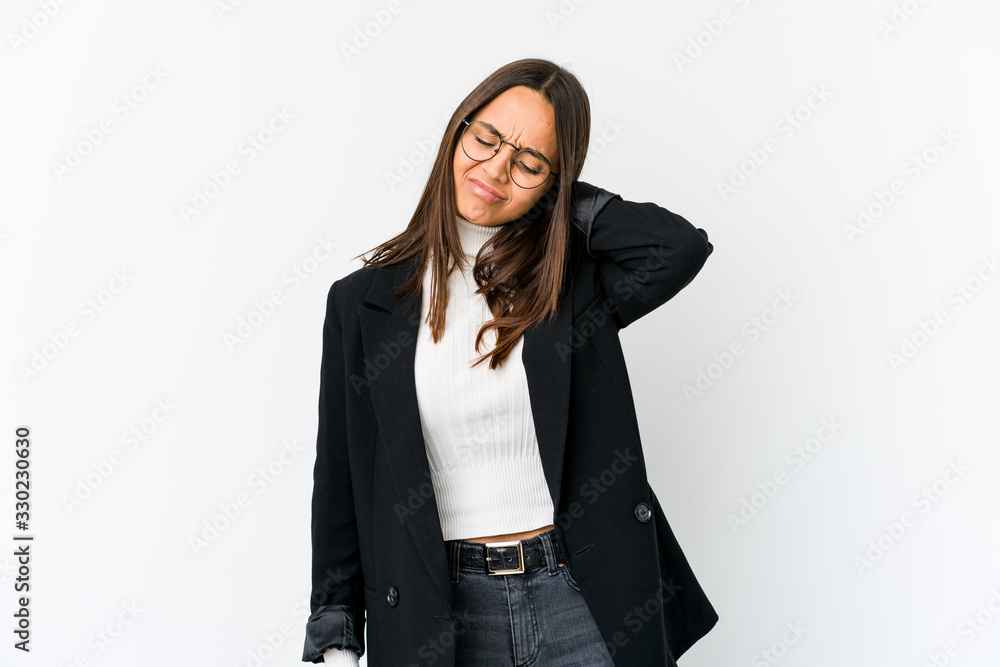 Young mixed race business woman isolated on white background suffering neck pain due to sedentary lifestyle. Young mixed race business woman isolated on white background suffering neck pain due to sedentary lifestyle.