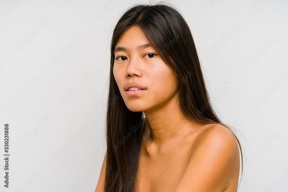 Young chinese woman face close up isolated Young chinese woman face close up isolated