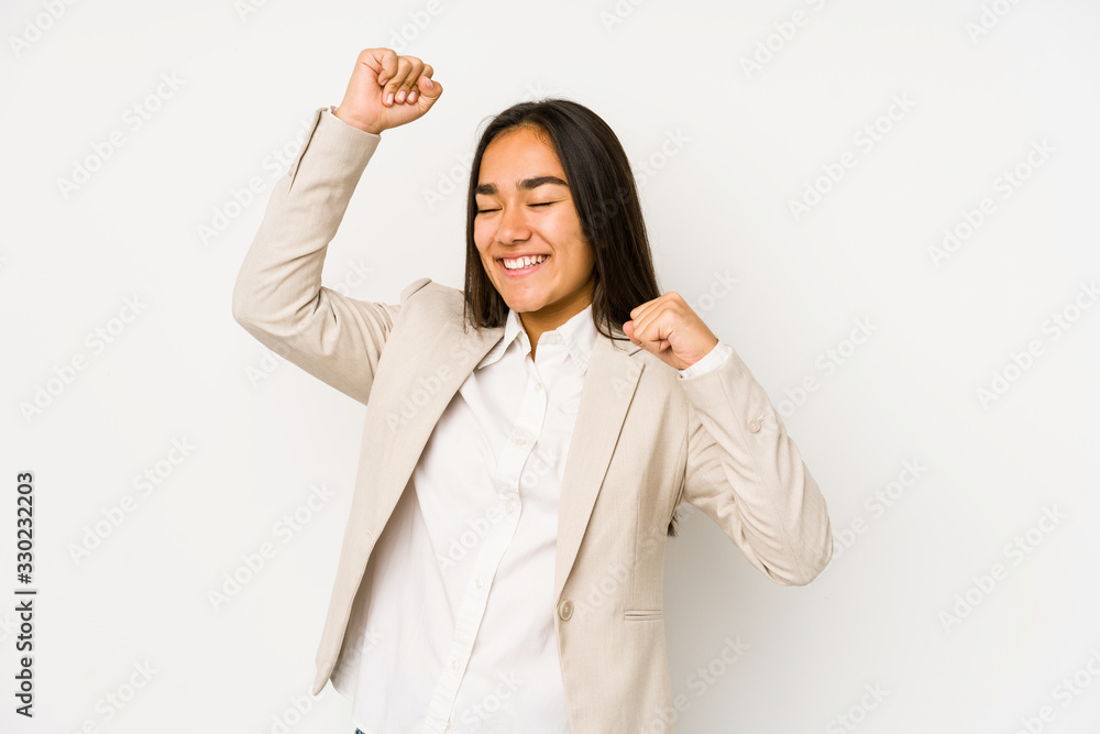 Young woman isolated on a white background celebrating a special day, jumps and raise arms with energy. Young woman isolated on a white background celebrating a special day, jumps and raise arms with energy.